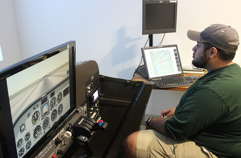 A man in a flight simulator.